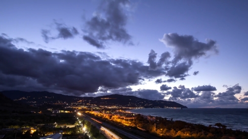 Sunset over the coast of Sicily. Patti, Italy. Time Lapse